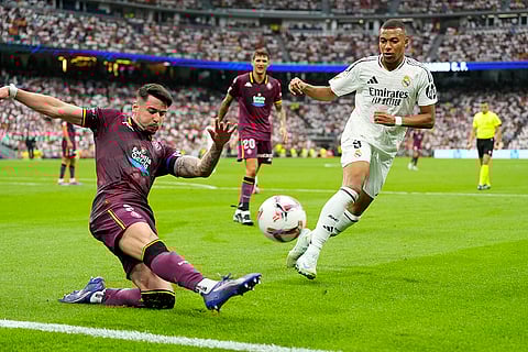 La liga 2024-25: Real Madrid's Kylian Mbappe, right, and Valladolid's Luis Perez challenge for the ball